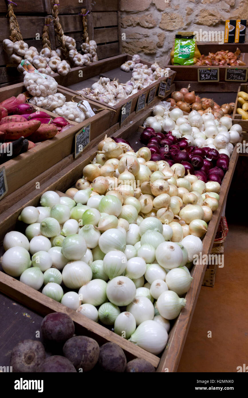 Onions and Garlic for sale in a French greengrocers Stock Photo
