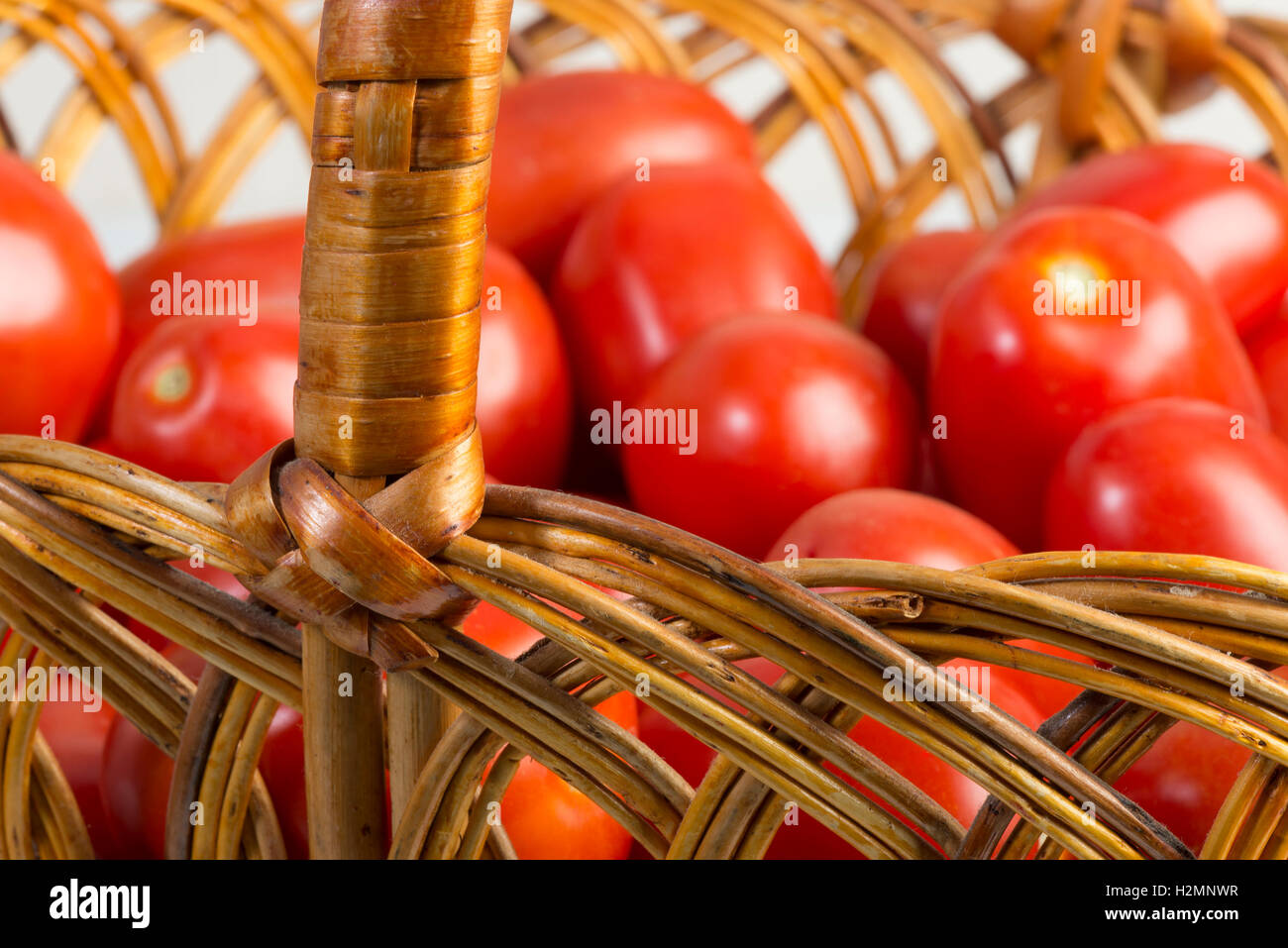 ripe red tomatoes arranged in a basket Stock Photo - Alamy