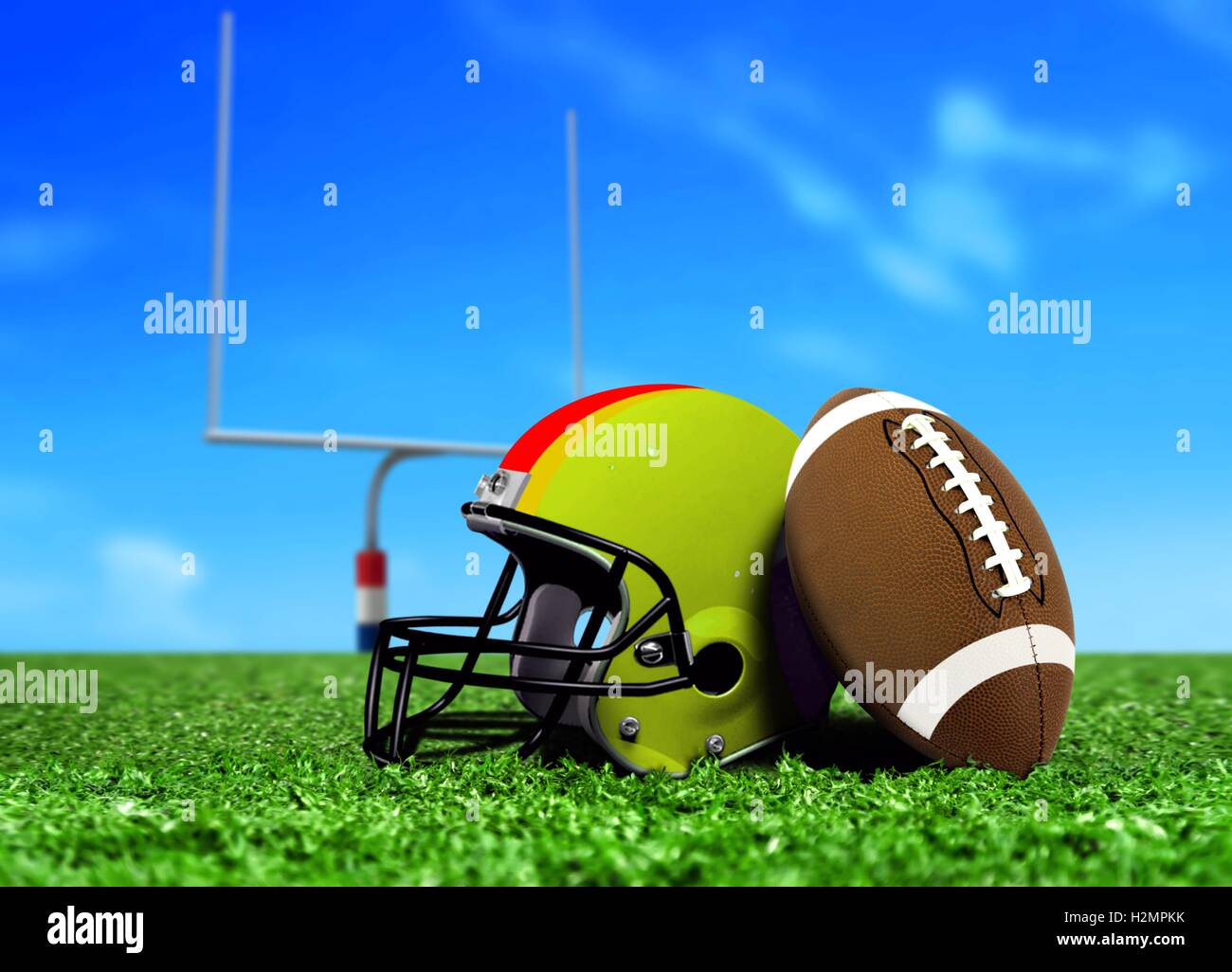 Football Ball and Helmet On Grass Stock Photo - Alamy