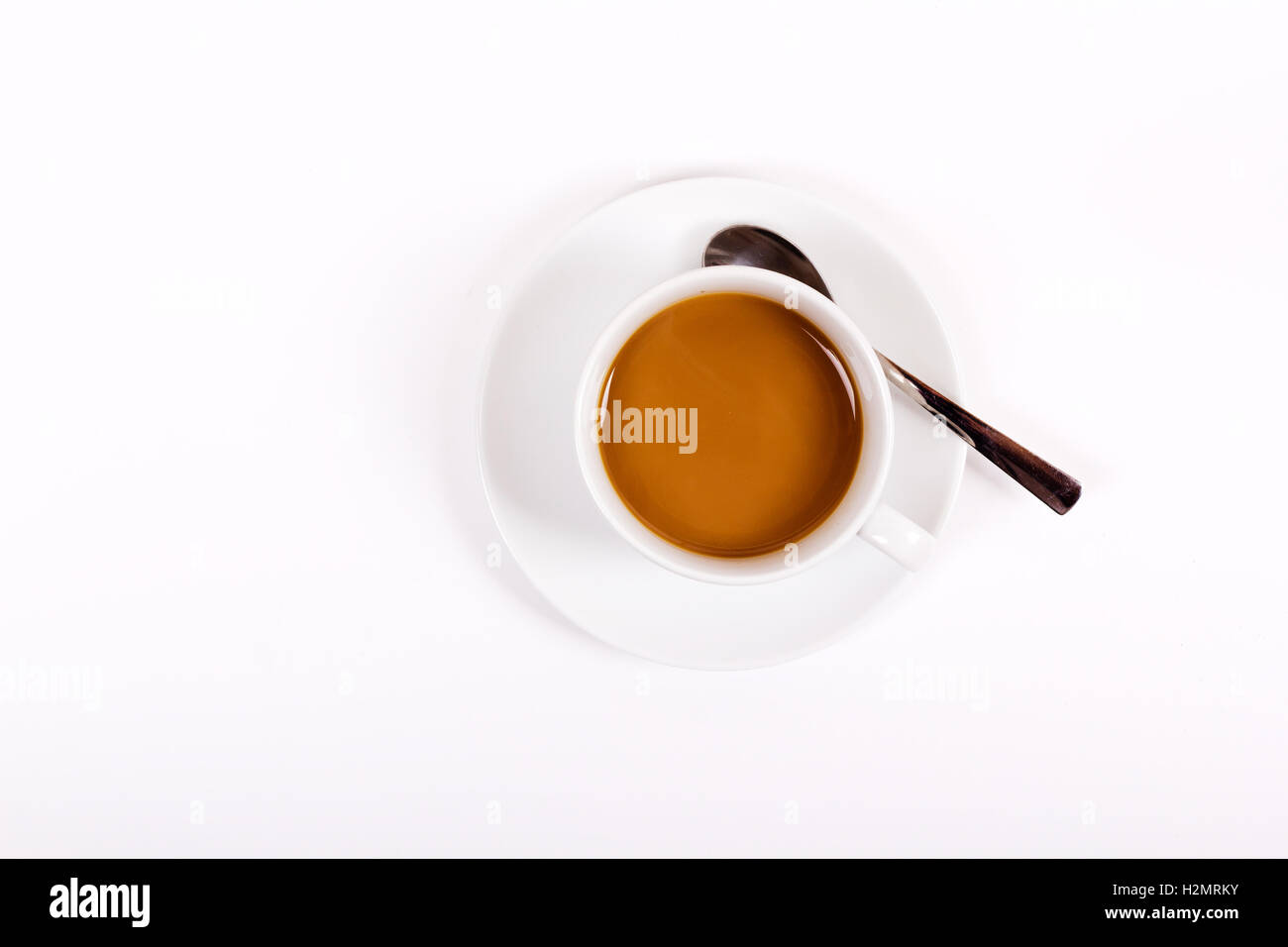 Coffee in white cup and saucer on a white background Stock Photo - Alamy