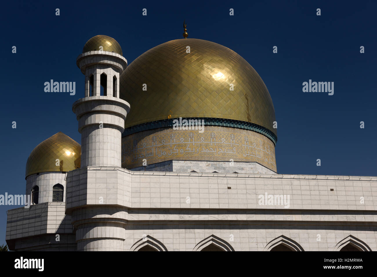 Golden domes and Turkish caligraphy of Central Mosque in Almaty Kazakhstan Stock Photo