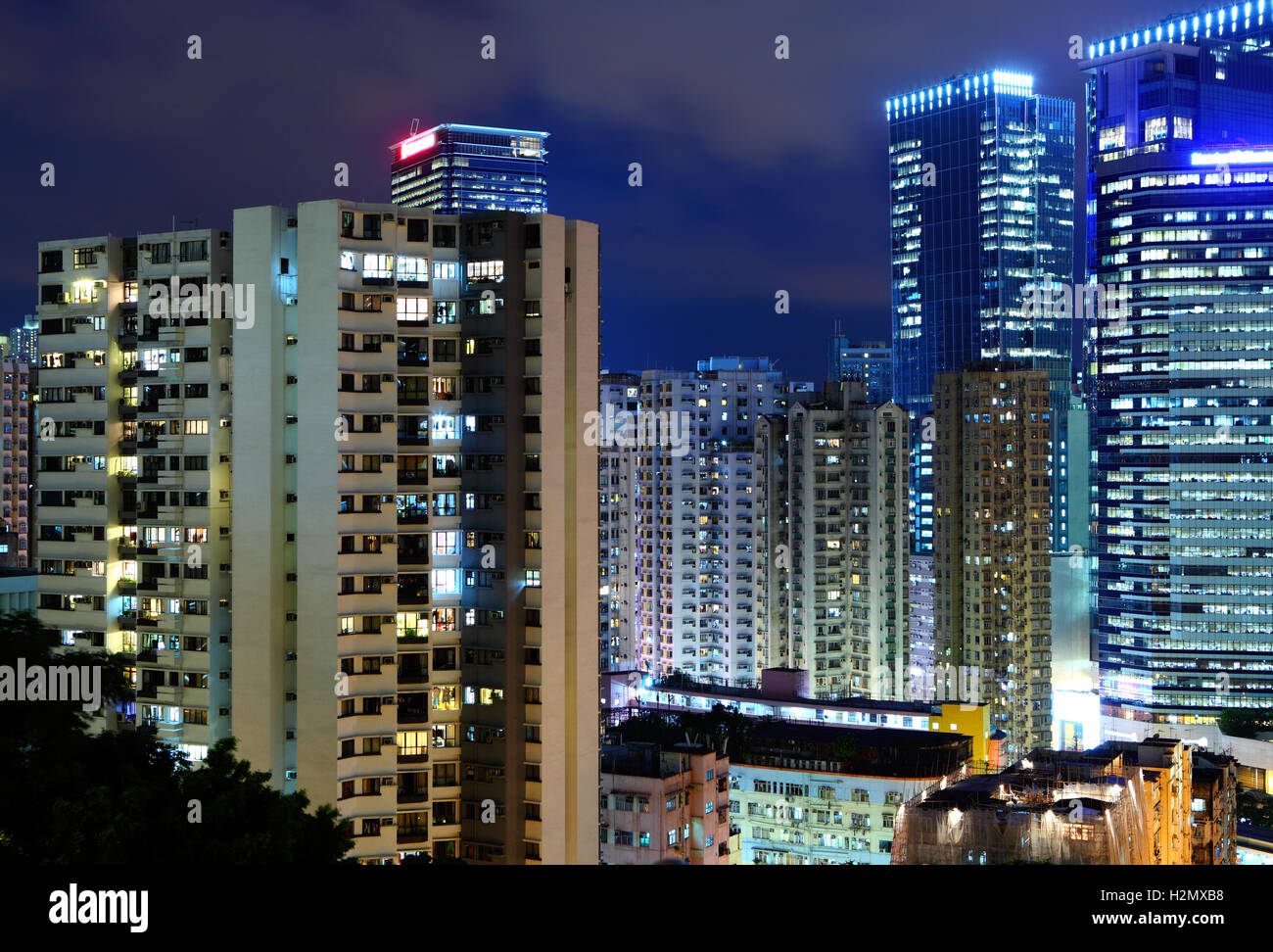 Hong Kong apartment building at night Stock Photo - Alamy