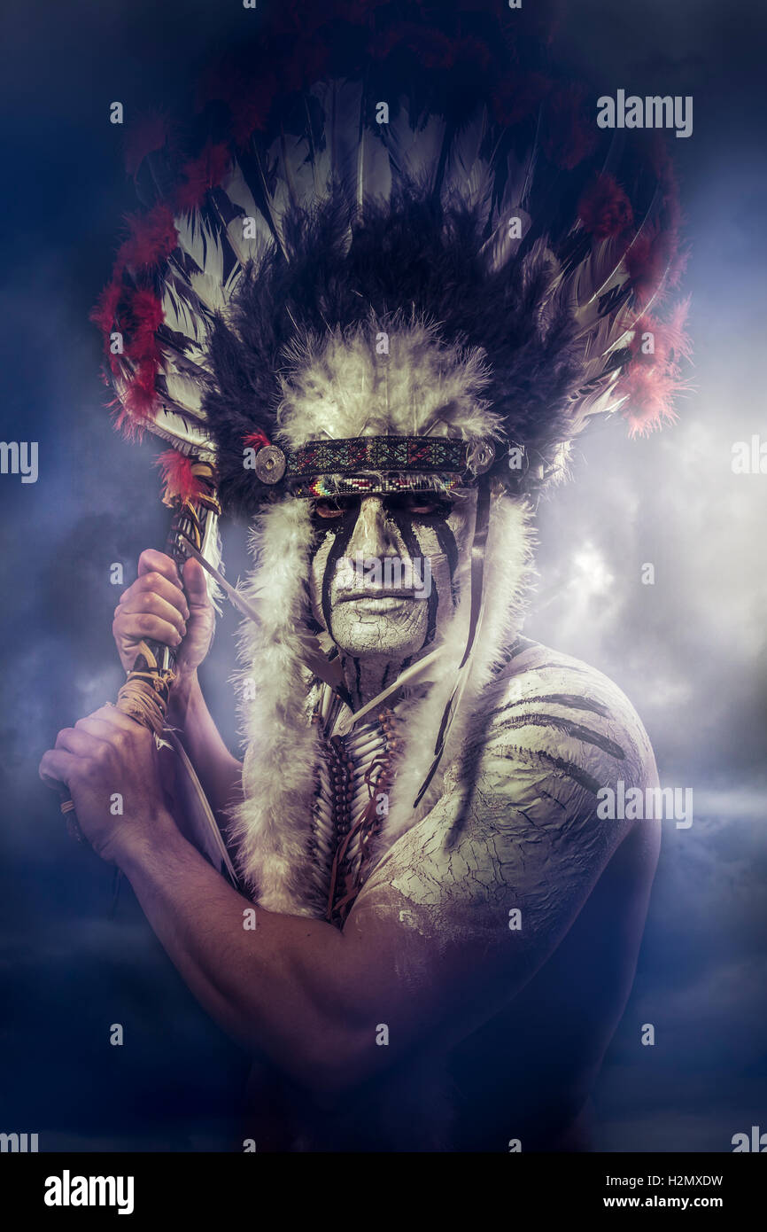 American Indian warrior, chief of the tribe. man with feather he Stock Photo