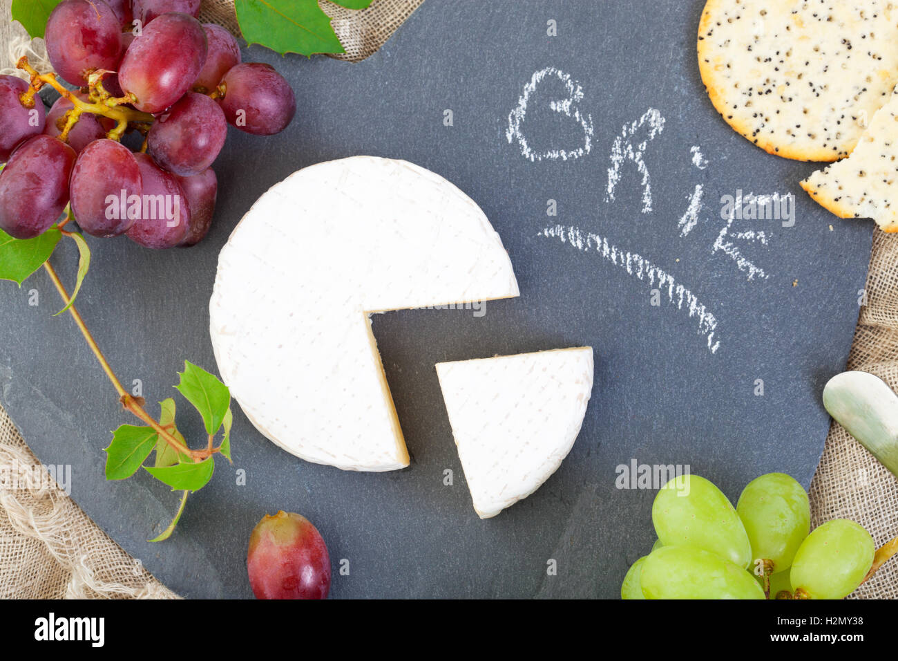 Brie Cheese with Grapes Stock Photo Alamy