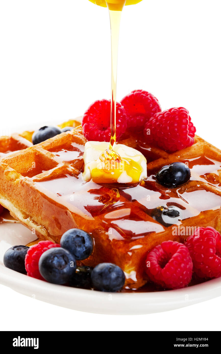 Syrup Pouring Over Waffles Stock Photo Alamy