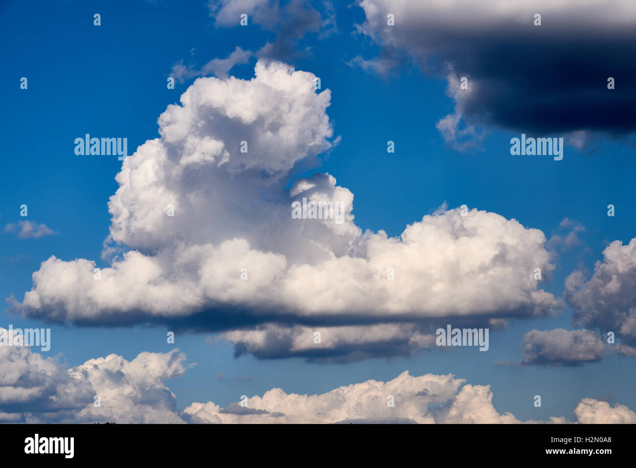 Vivid and dramatic clouds with blue sky shining through Stock Photo Alamy