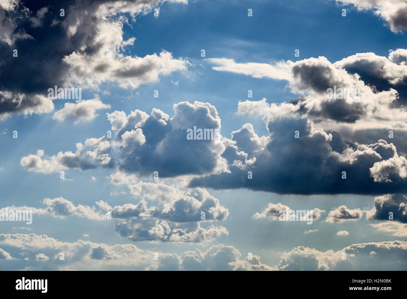Vivid and dramatic clouds with blue sky shining through. Stock Photo