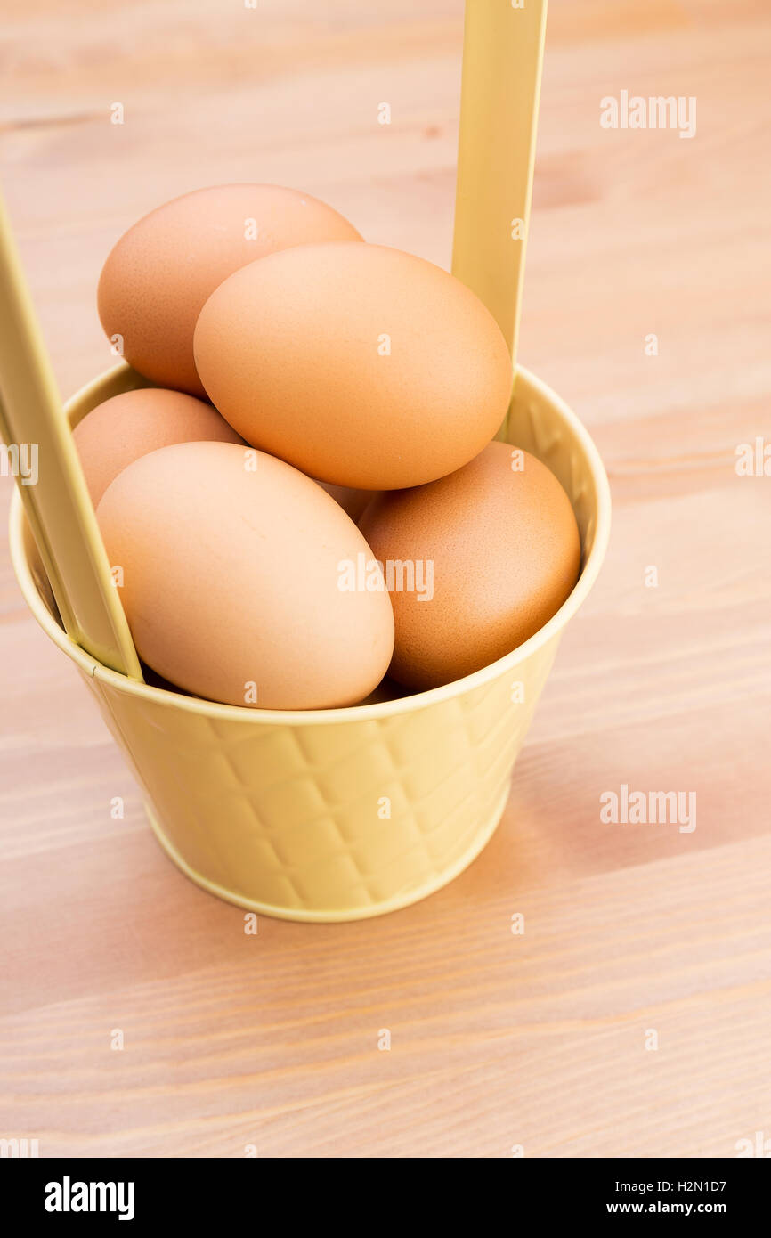 Brown egg in bucket Stock Photo