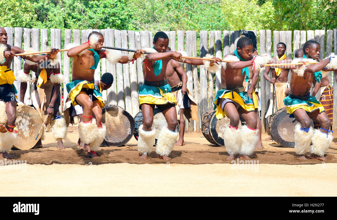 Swazi traditional troupe singing and dancing at the  Mantenga Swazi Cultural Village (Ligugu Lemaswati) Ezulwini Valley, Eswatini (formerly Swaziland) Stock Photo