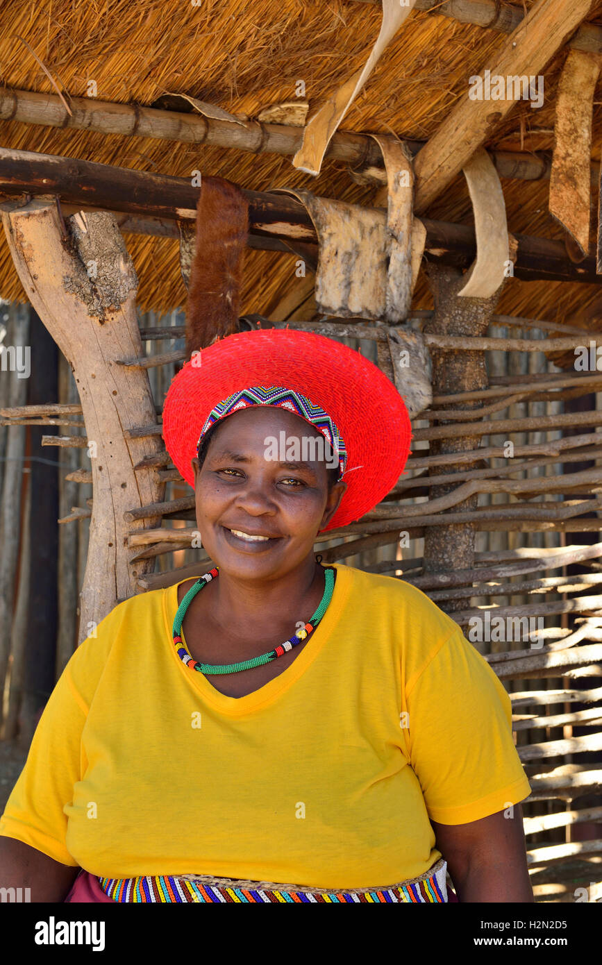 Shakaland Zulu lady troupe member poses in a traditional  Zulu hat at the  Shakaland Cultural Village Stock Photo