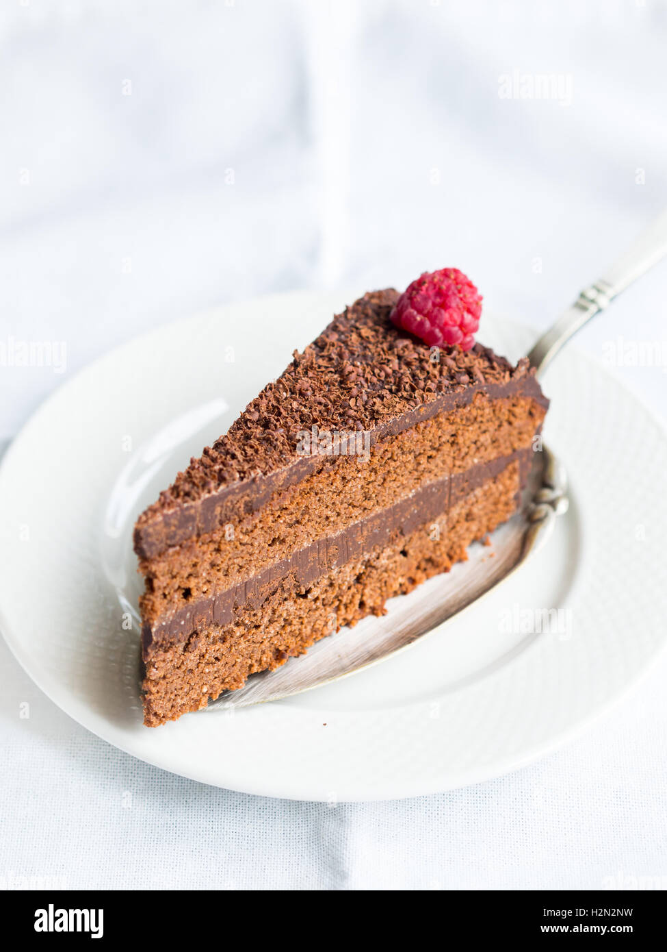 Piece of paleo flourless gluten free chocolate cake. Stock Photo