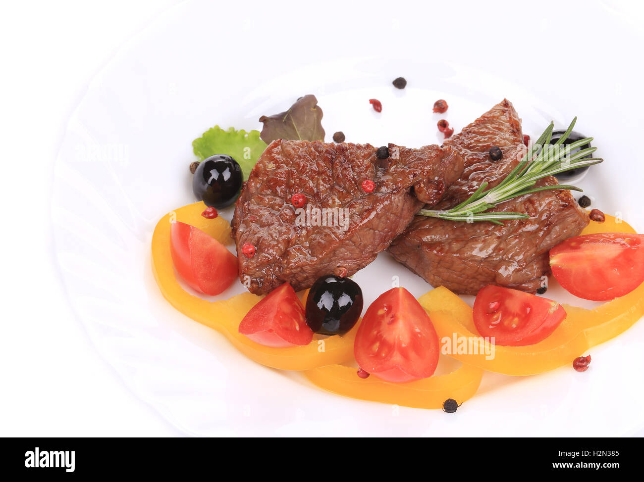 Grilled steak with fresh vegetables. Stock Photo