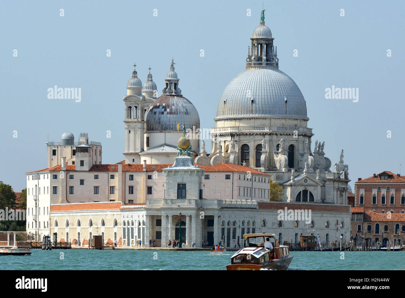 Basilica Santa Maria della Salute with the Punta della Dogana of Venice in Italy. Stock Photo