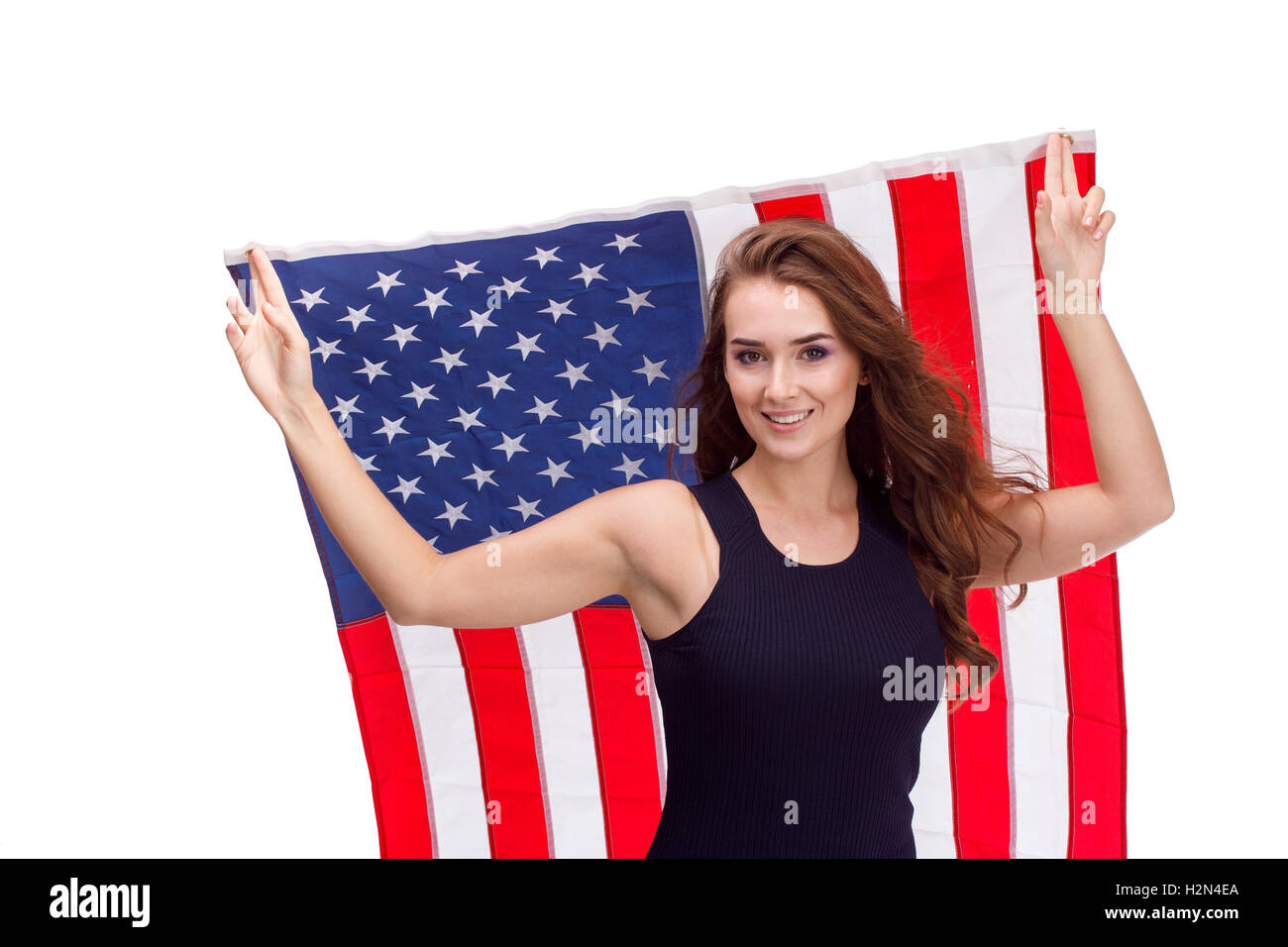 Happy young woman holding USA flag. Image isolated on a white ...