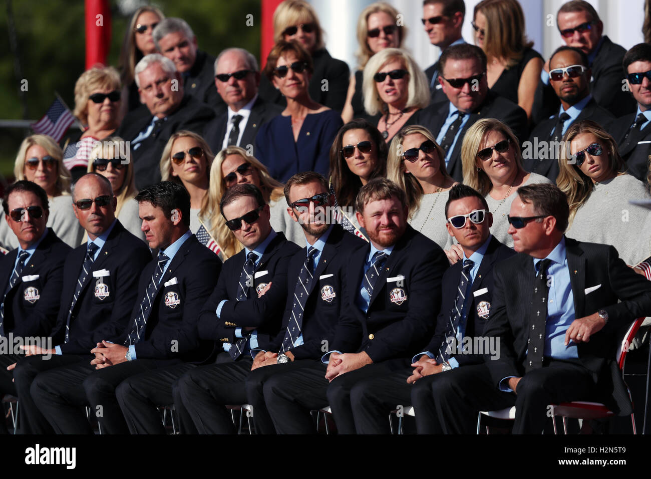 Team USA sit in front of their wives and girlfriends during the opening