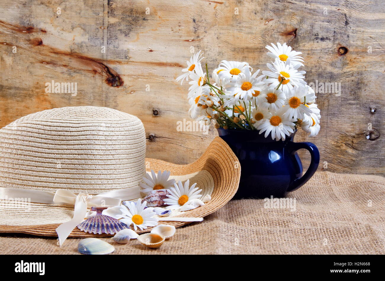 closeup of the daisy flowers and hat,summer concept Stock Photo - Alamy