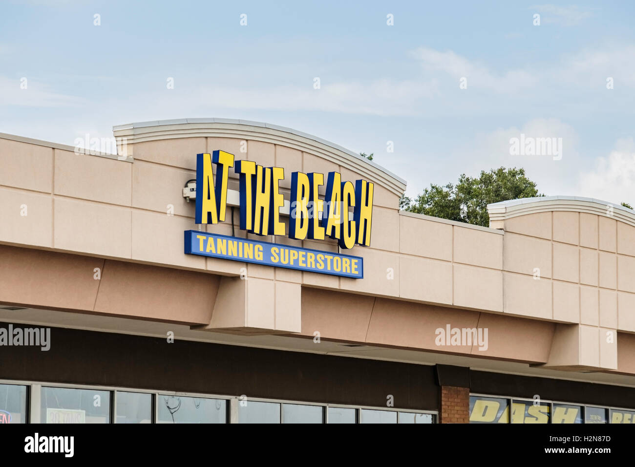 The exterior logo and sign of At The Beach, a tanning superstore located at 2108 SW 74th, Oklahoma City, Oklahoma, USA. Stock Photo