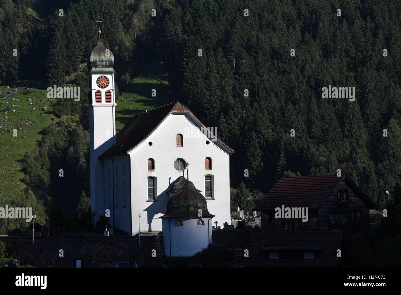 Beautiful church of Wassen on the Swiss alps Stock Photo