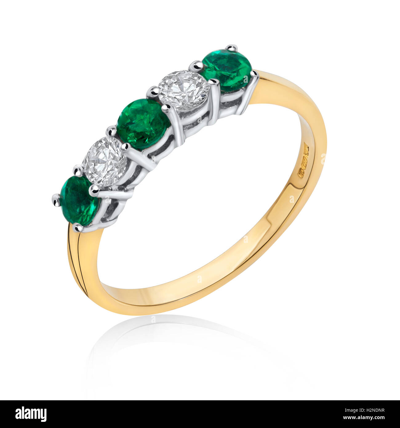 Emerald and diamond eternity ring set in yellow gold Stock Photo