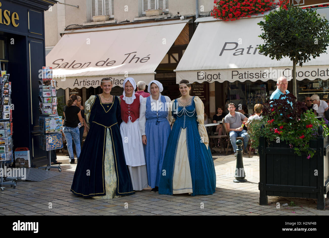 Amboise France - Four women in period costume walking in the old town center of Amboise situated along the Loire valley Stock Photo