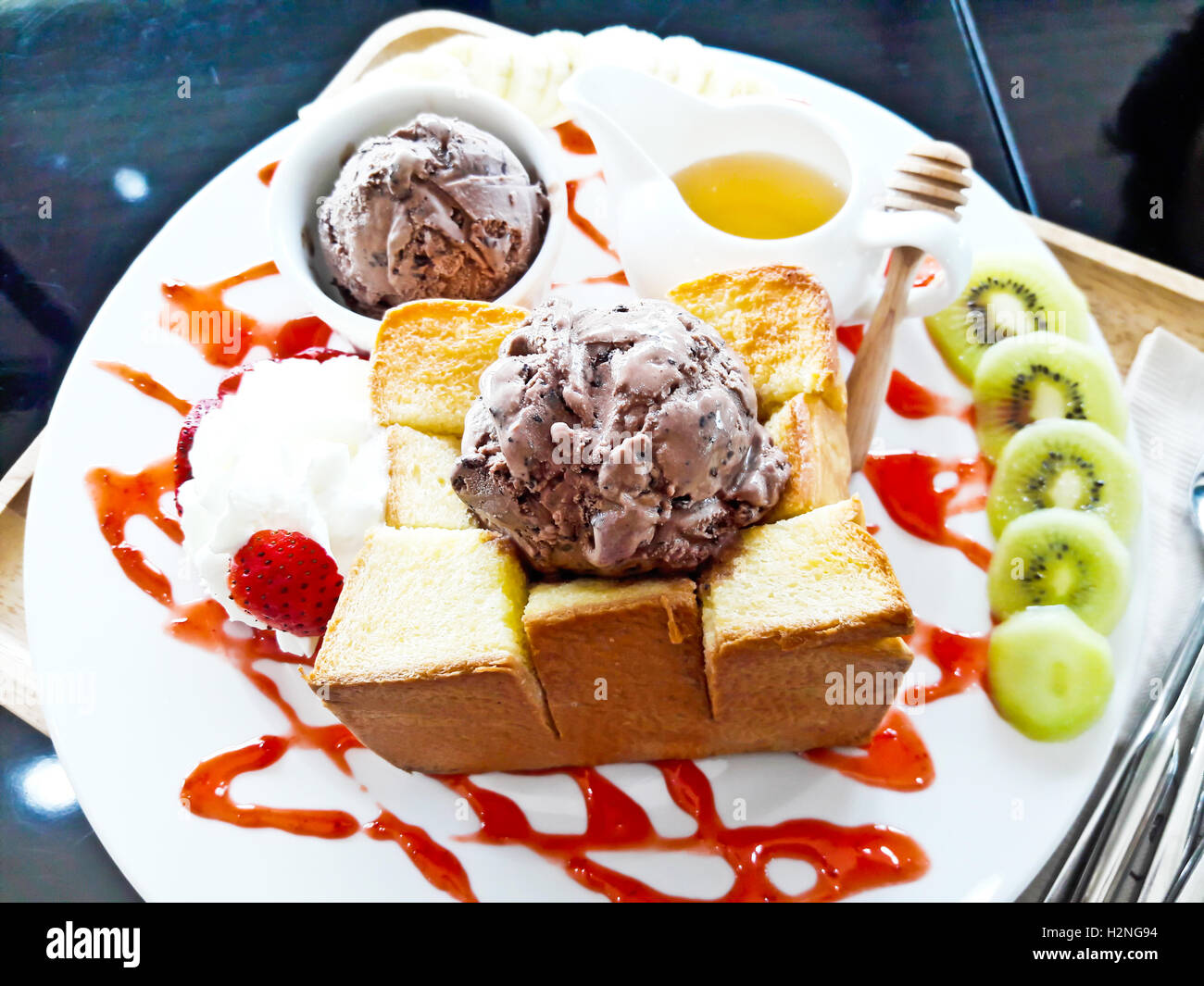 Honey toast with ice cream and fruit Stock Photo