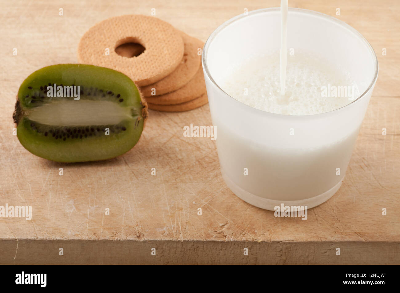 Breakfast with milk and cookies and kiwi Stock Photo