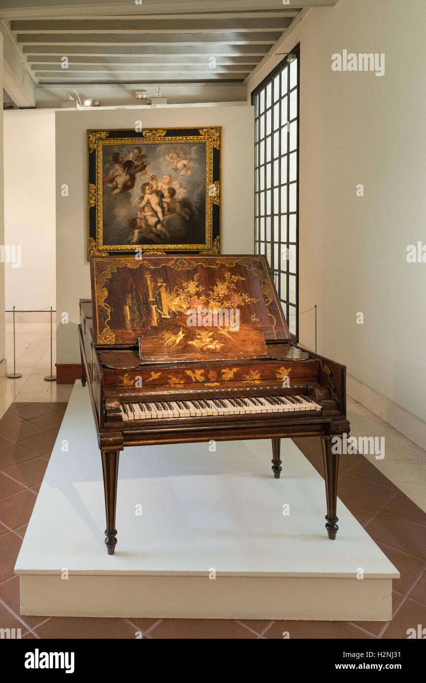 Piano and painting on exhibit in Seville museum Stock Photo - Alamy