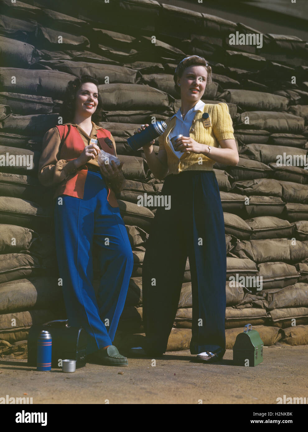 Two Female Factory Workers on Lunch Break, Douglas Aircraft Company, Long Beach, California, USA, Alfred T. Palmer, U.S. Office of War Information, October 1942 Stock Photo