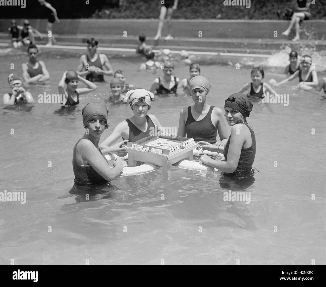 Four Women Playing Mah-Jong in Water at Bathing Beach, Washington DC, USA, National Photo Company, June 1924 Stock Photo