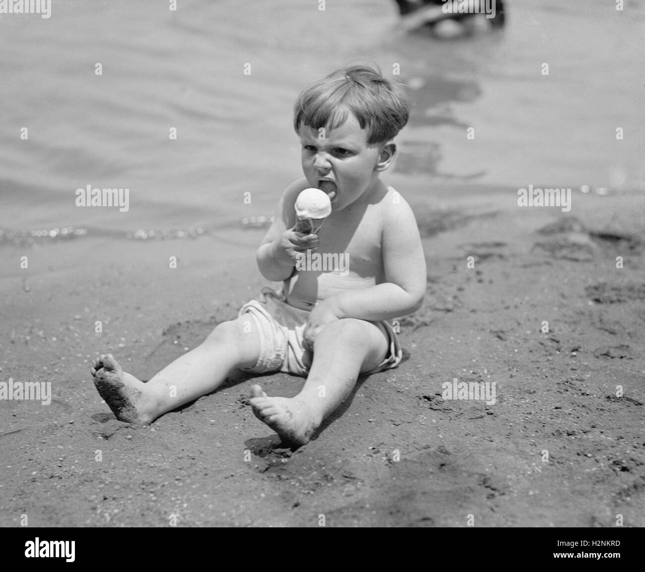 Boy eating an ice cream Black and White Stock Photos & Images - Alamy
