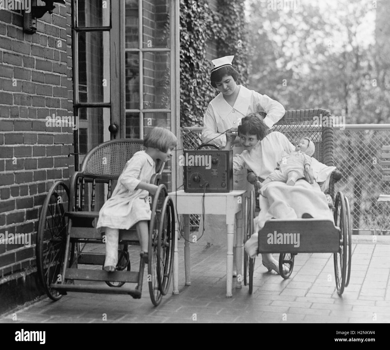 Two Young Girls Listening to Radio at Children's Hospital, Washington DC, USA, National Photo Company, August 1924 Stock Photo