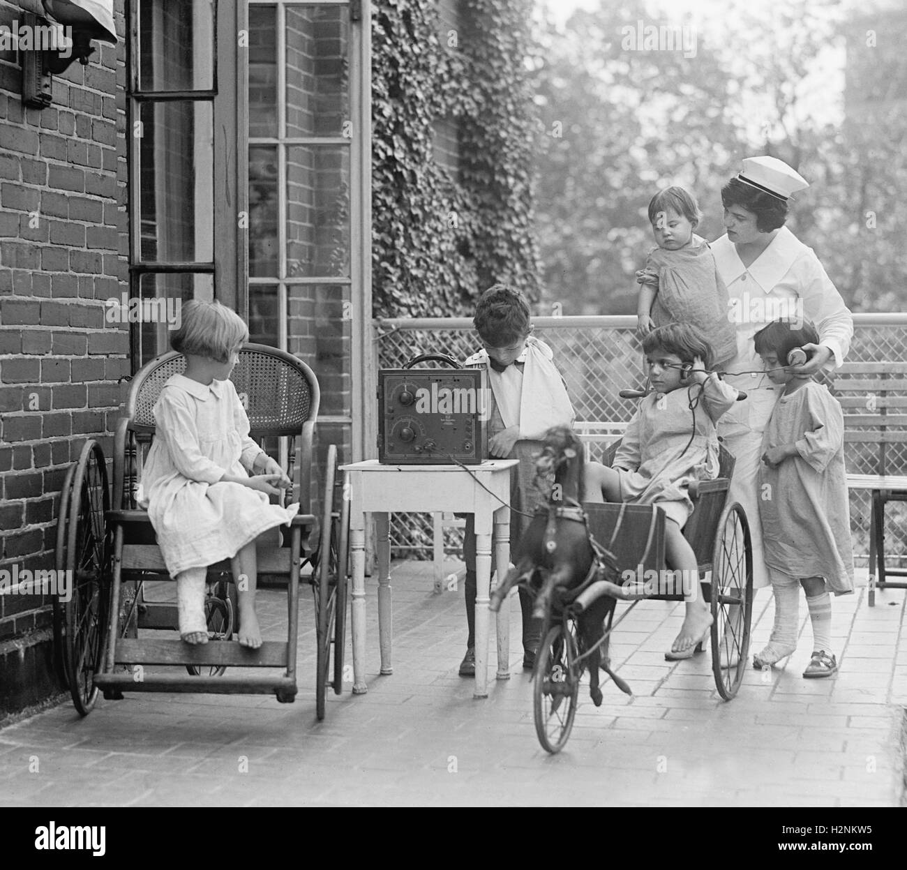 Group of Young Children Listening to Radio at Children's Hospital, Washington DC, USA, National Photo Company, August 1924 Stock Photo