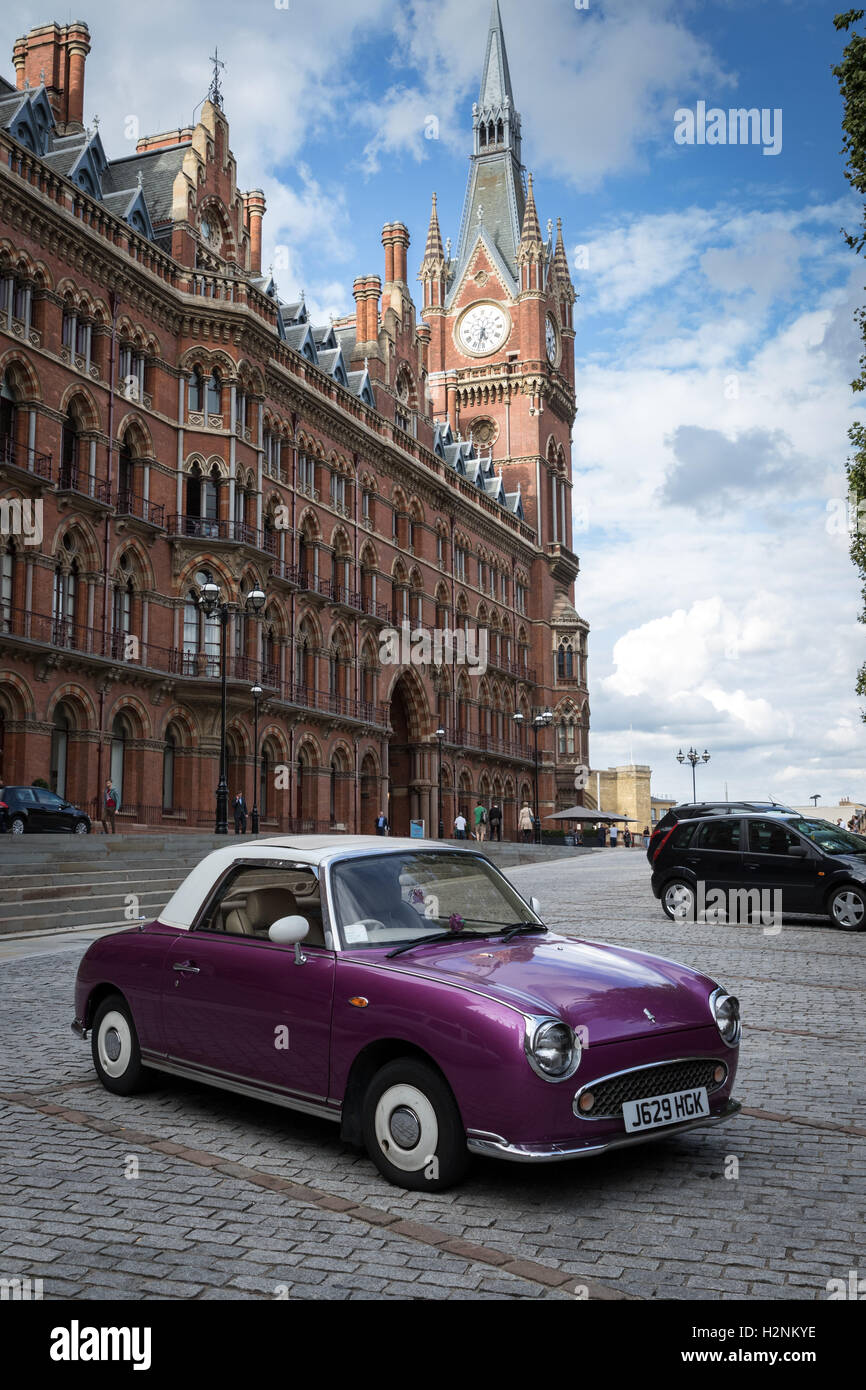 A Nissan Figaro car parked at St Pancras railway station and hotel in north London Stock Photo
