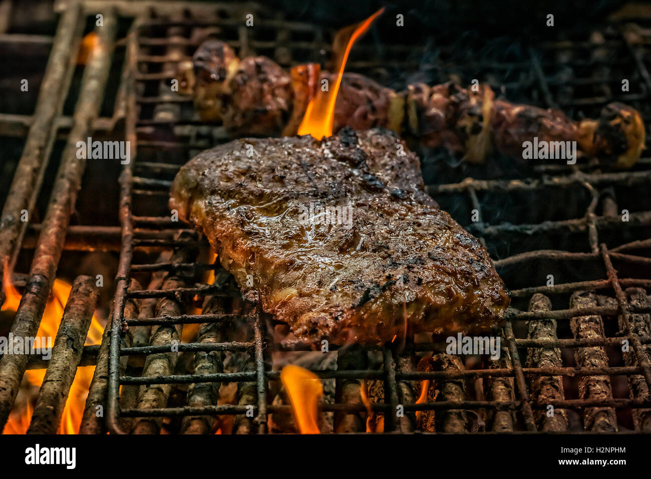 South african barbecue outdoor kitchen with spareribs and meat skewer on  the grill Stock Photo - Alamy