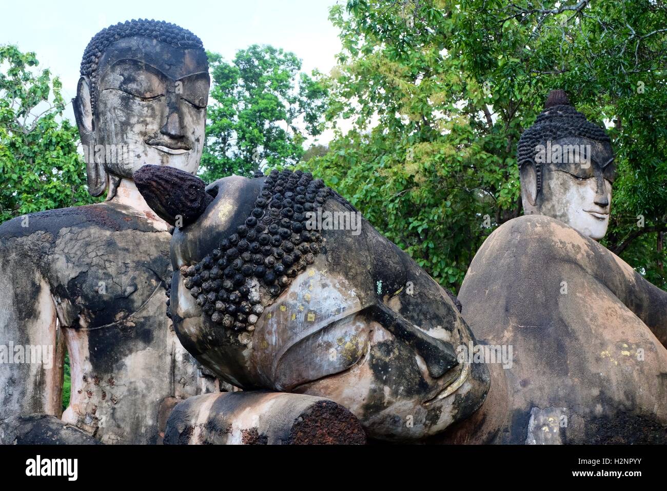 3 bouddhas statues at Kamphaeng Phet Historical Park Stock Photo