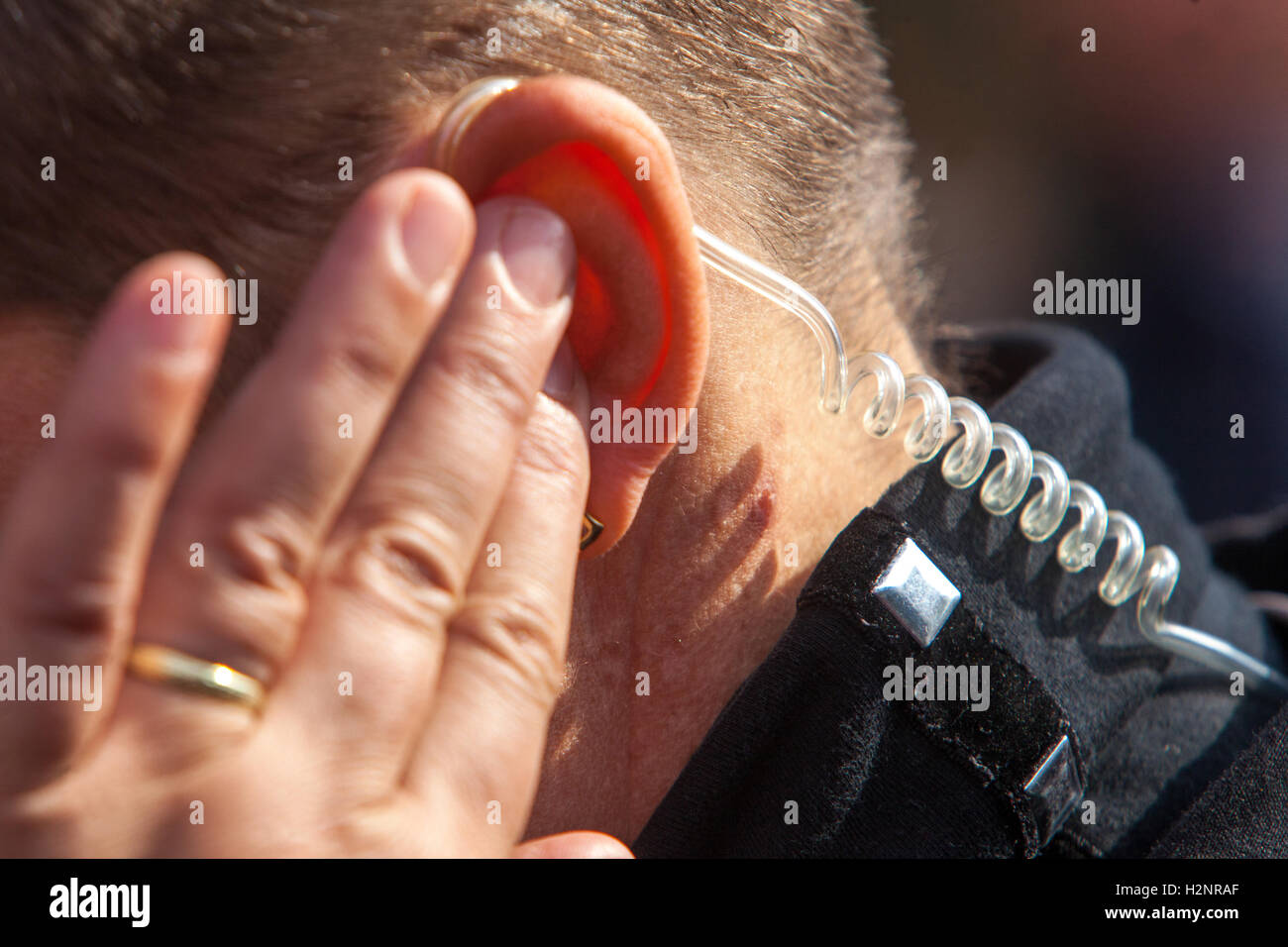 Bodyguard and earpieces, detail ear, security Stock Photo