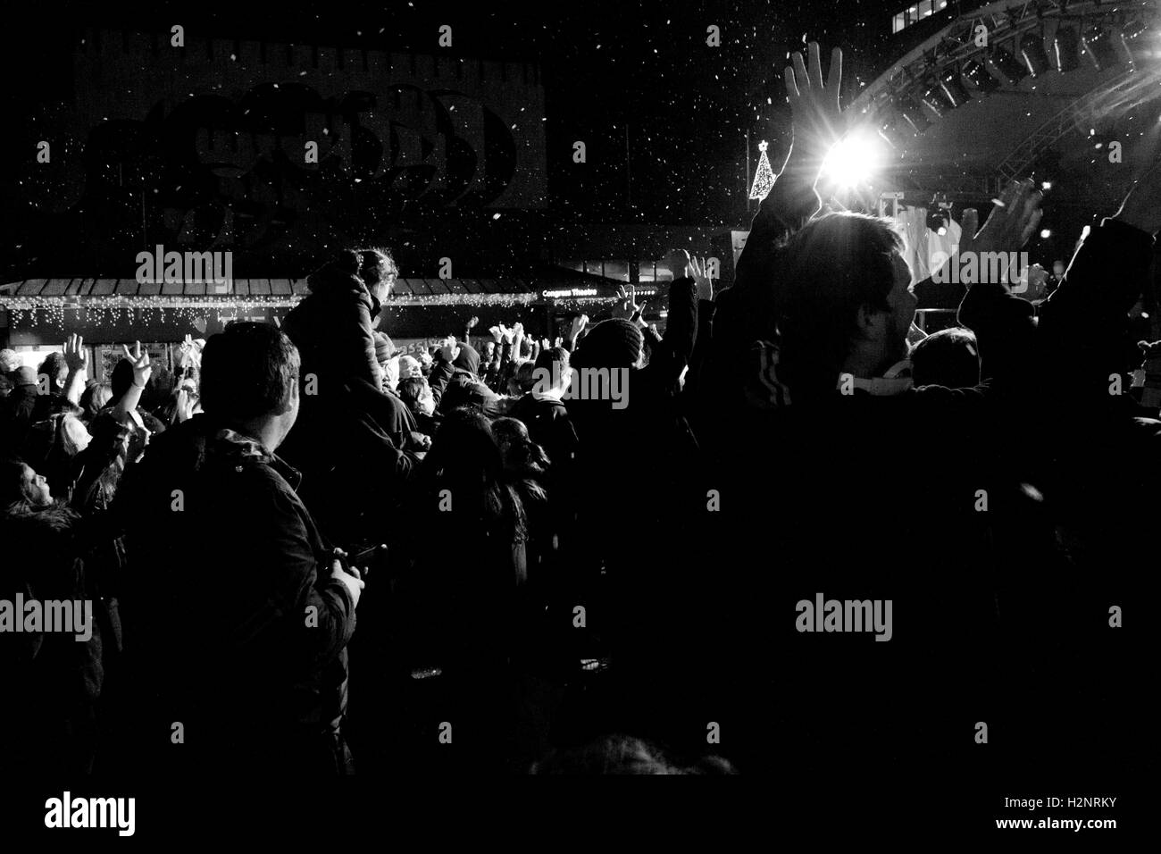 Crowd cheering as the Christmas lights get switched on in Cwmbran, Torfaen in December 2014. Stock Photo