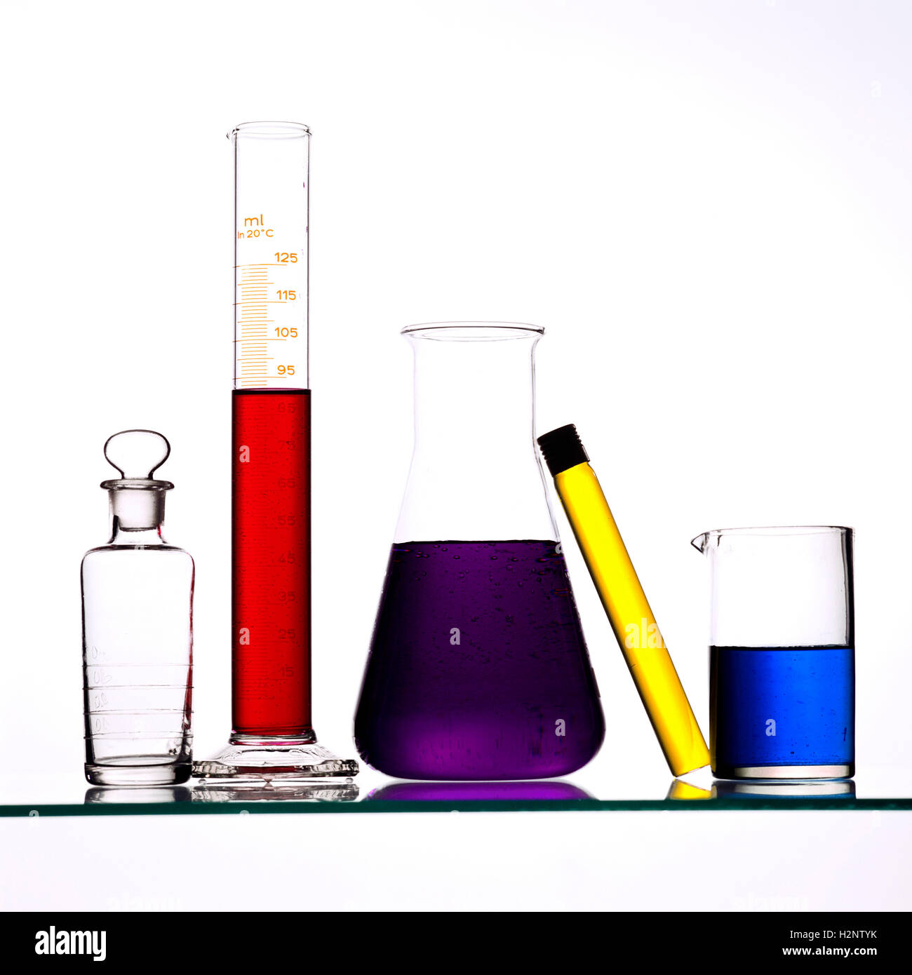 Bottles with test tubes on a shelf hires stock photography and images