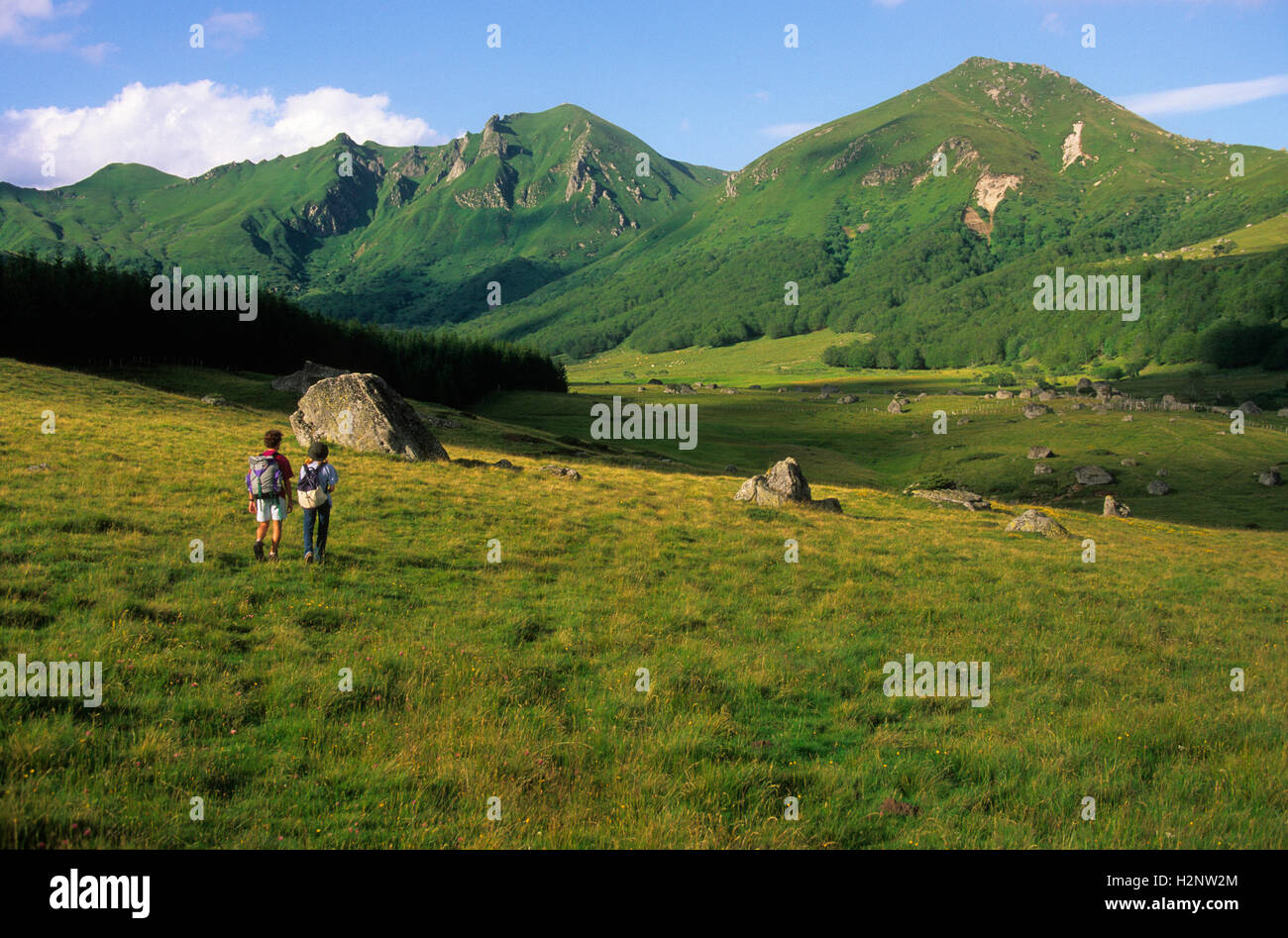 Hikers, Vallée de la Fontaines Salées valley, Massif du Sancy, Auvergne, France, Europe Stock Photo