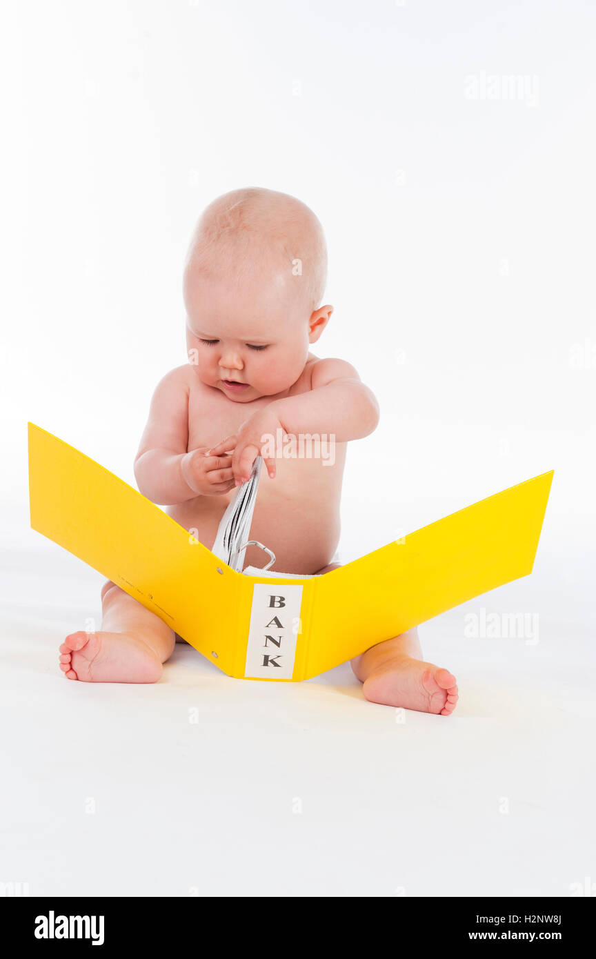 Baby, ten months, with bank receipts Stock Photo