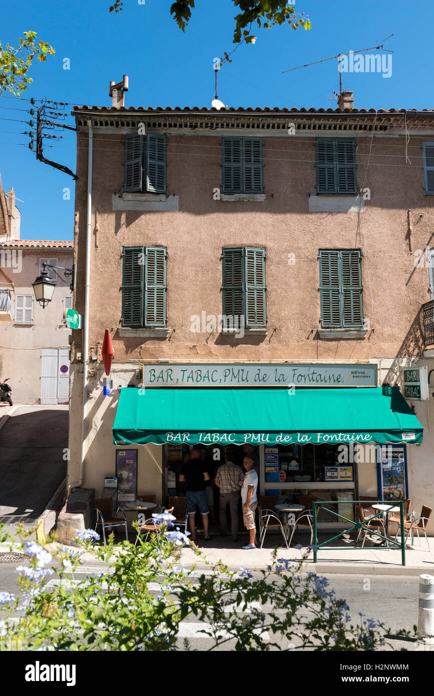 People standing at a Bar and tabac shop, Pierrefeu, Provence-Alpes-Côte d'Azur region, southeastern France Stock Photo