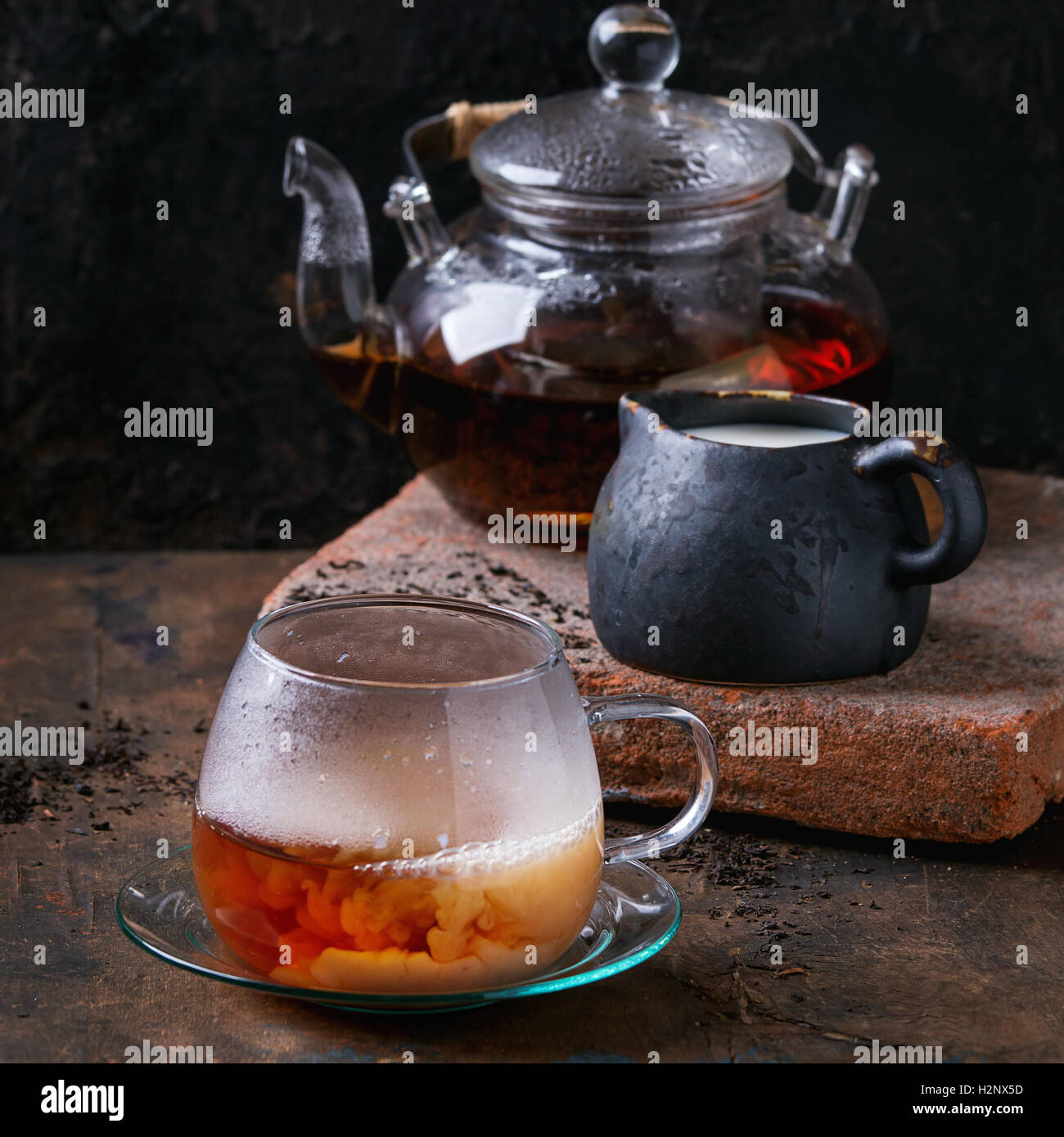 Cup of black tea with milk Stock Photo Alamy