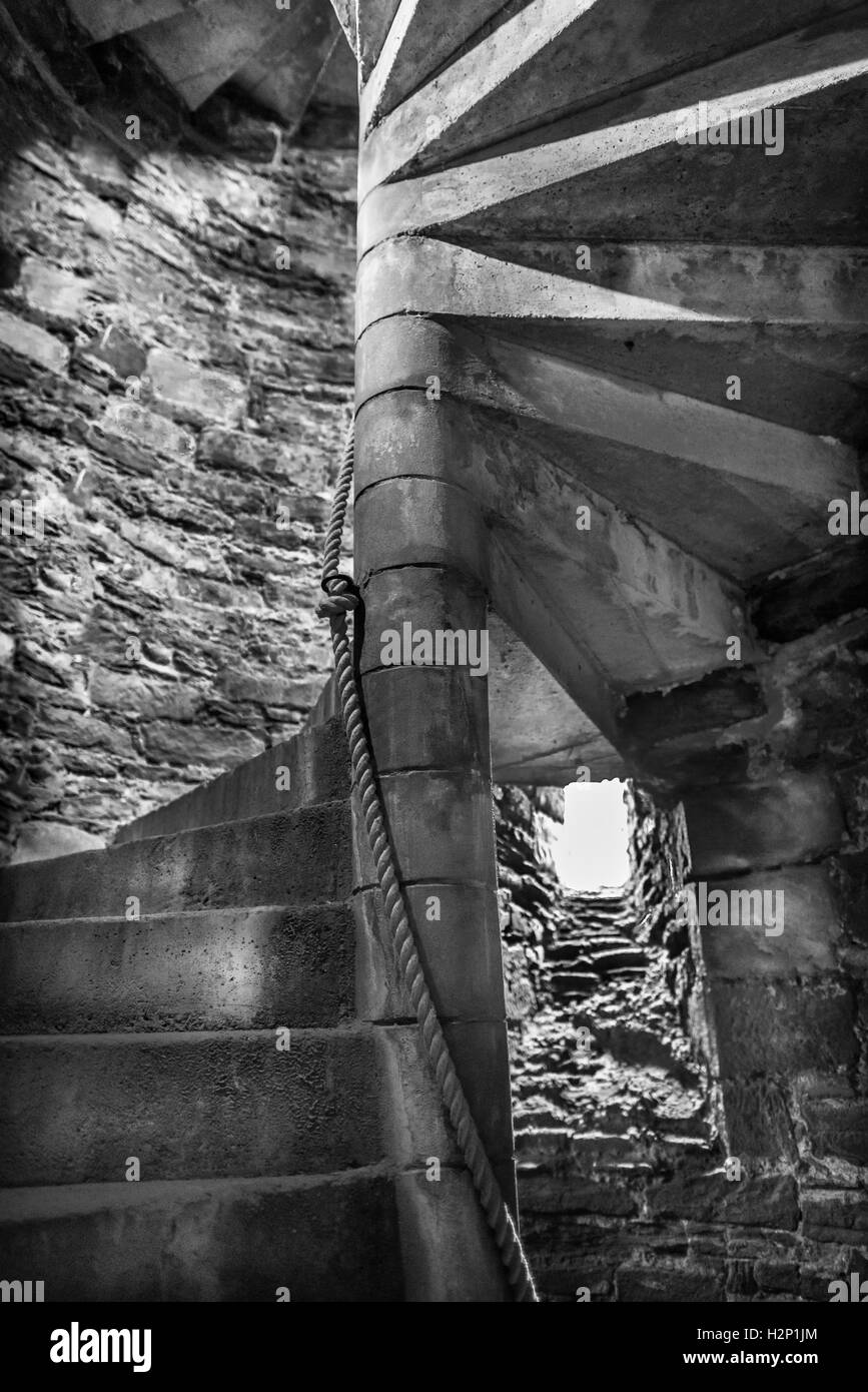 Medieval spiral stone staircase. Stock Photo