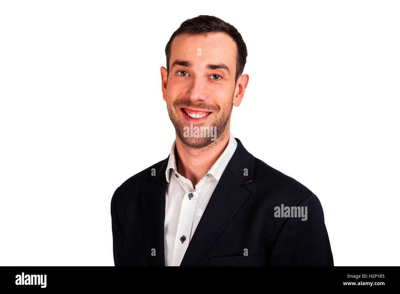 Smiling man in suit isoleted over white background. Black jacket and white shirt. Stock Photo