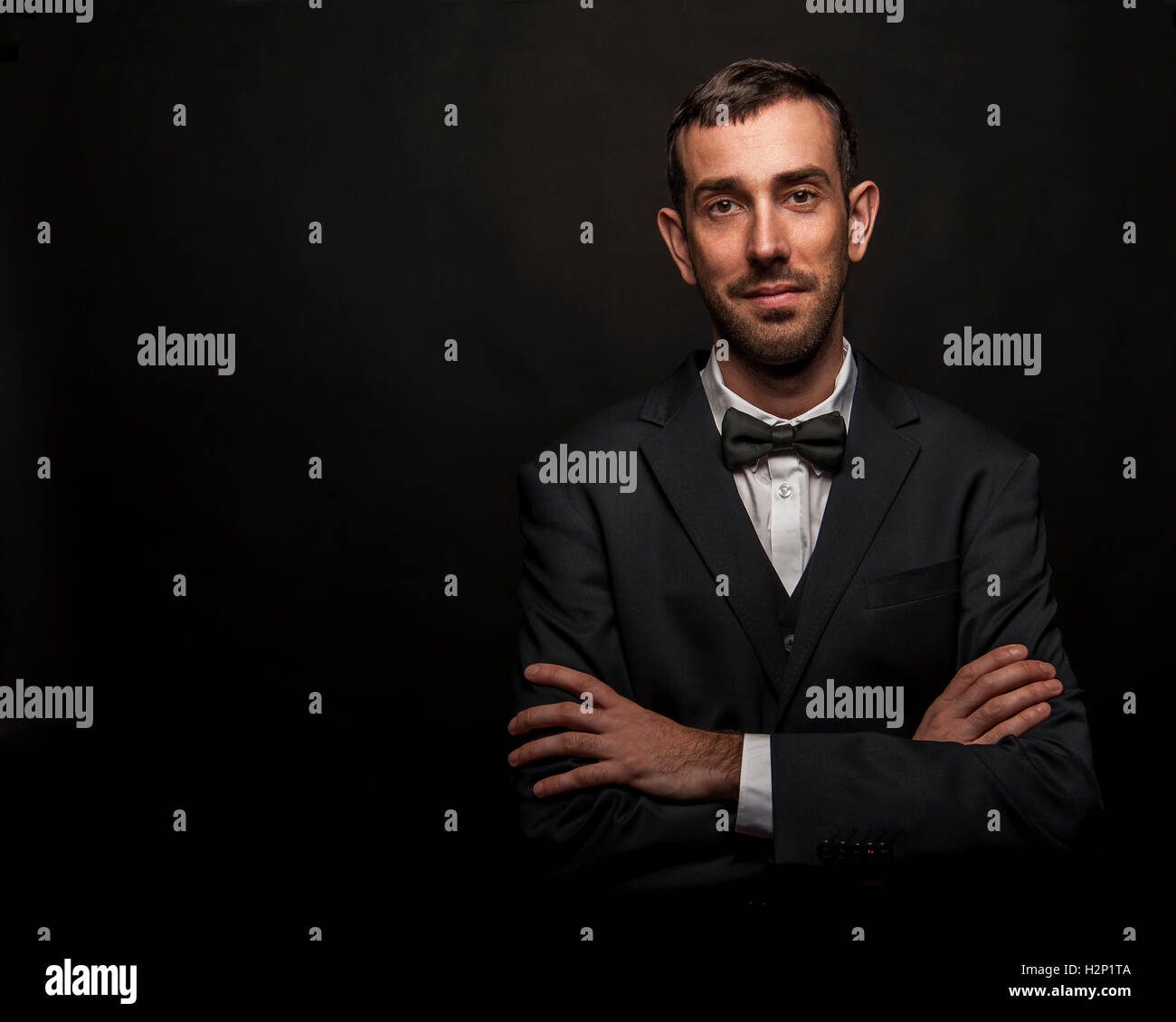 Portrait of handsome stylish man in elegant black suit Stock Photo - Alamy