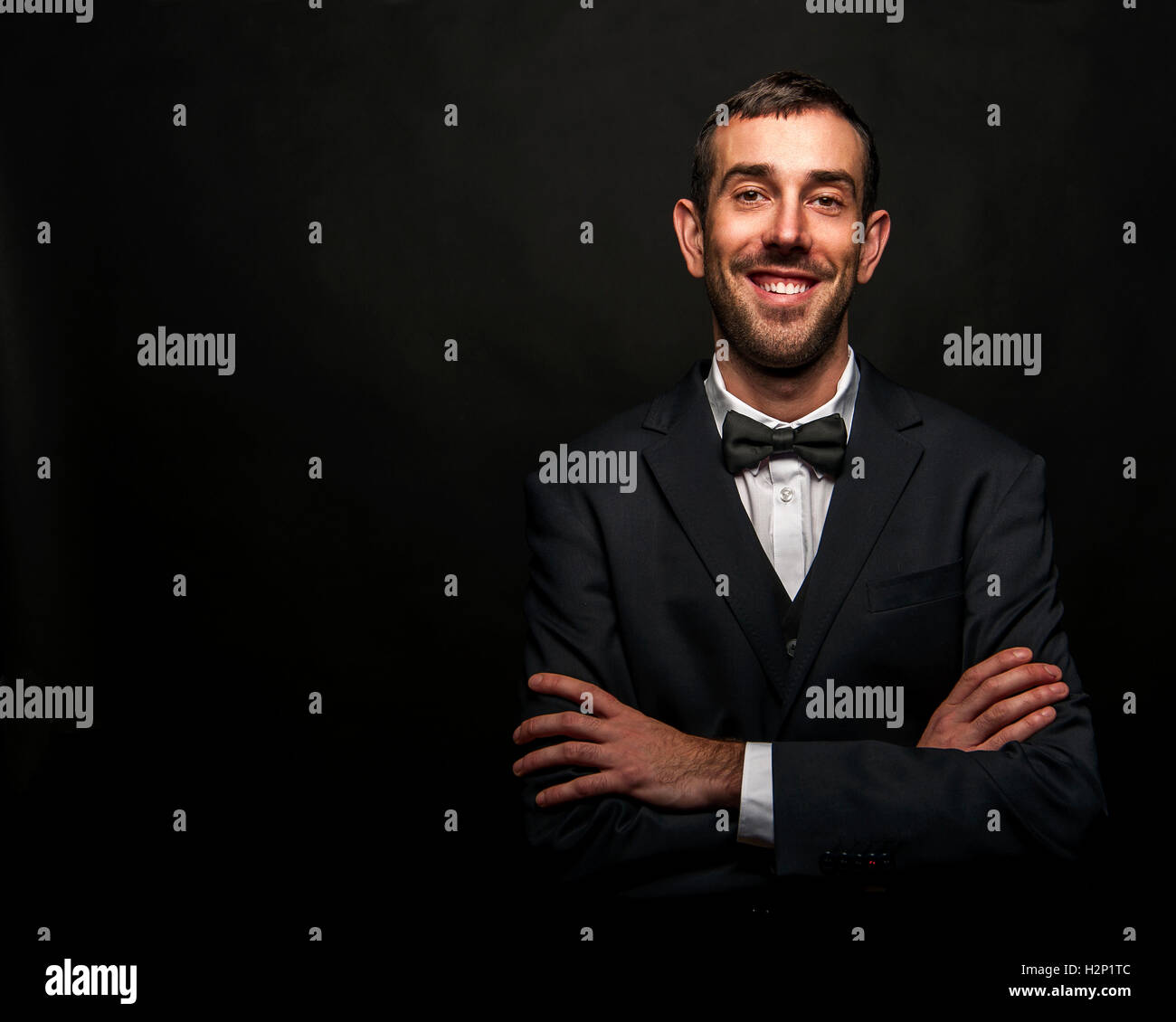 Portrait of handsome stylish man in elegant black suit Stock Photo - Alamy