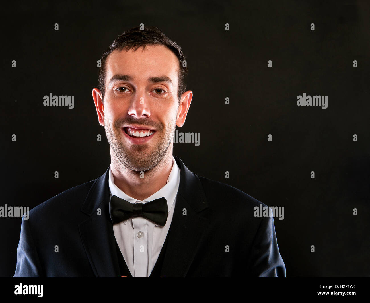 Portrait of handsome stylish man in elegant black suit Stock Photo - Alamy