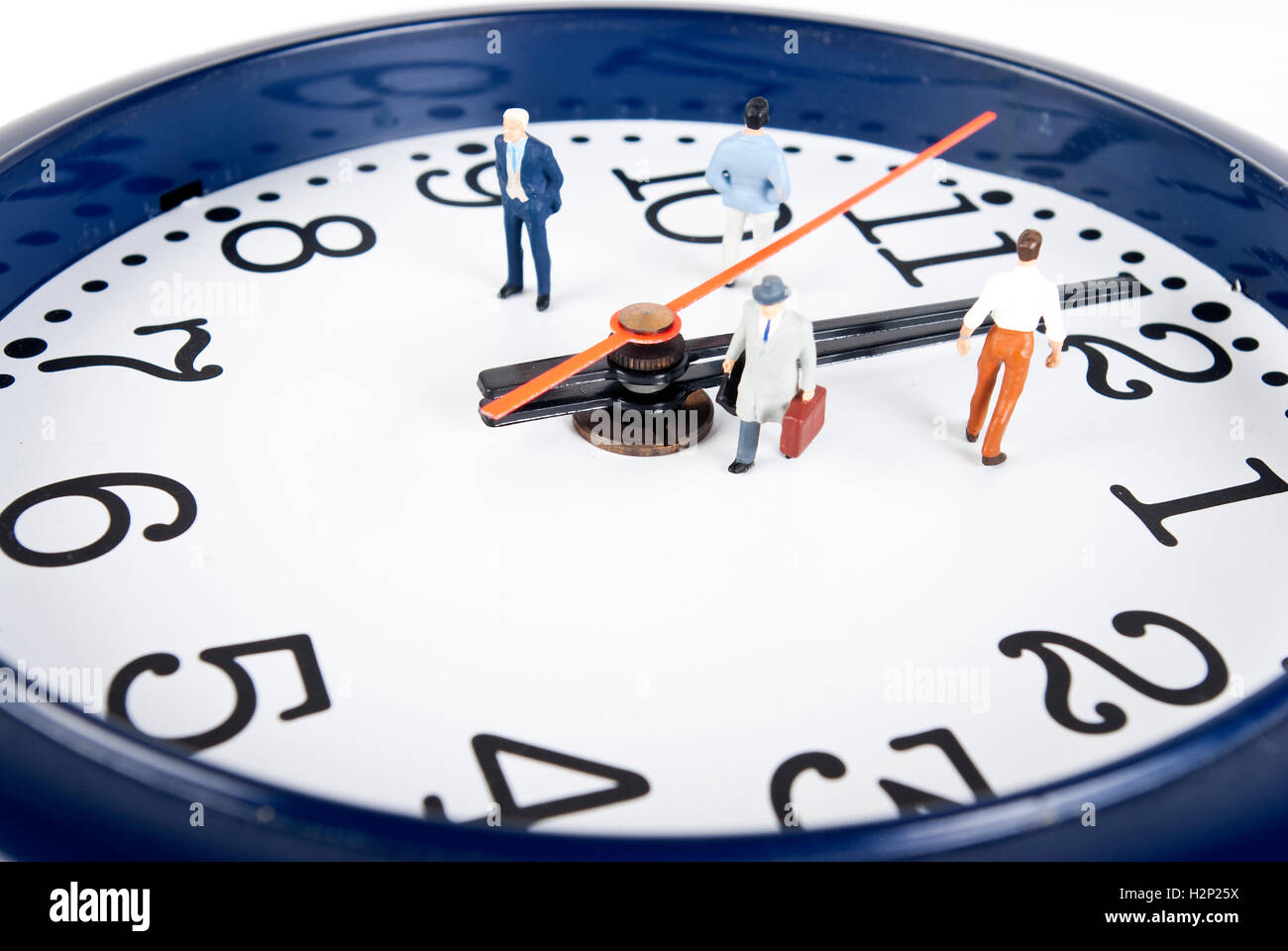 some people on clock of time Stock Photo - Alamy