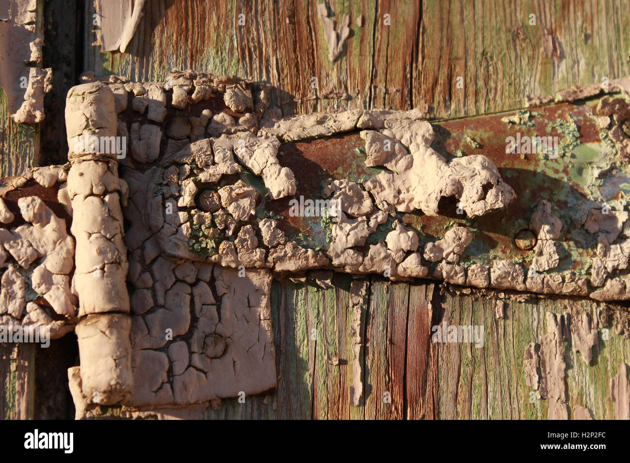 metallic hinge covered in crusty paint Stock Photo Alamy