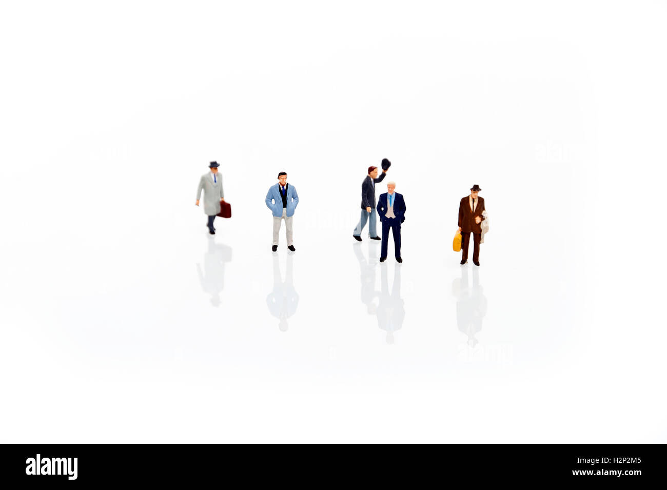 miniature man in one row Stock Photo